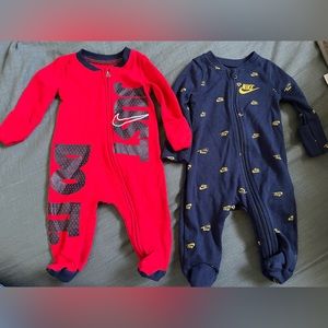 3 newborn Nike onesies